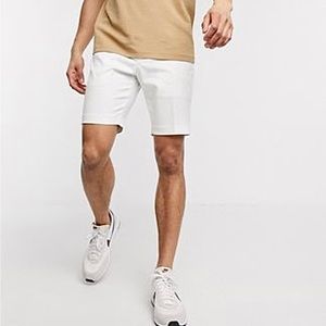 ASOS DESIGN slim fit smart shorts in white.